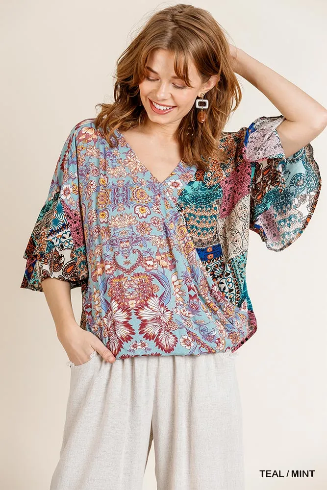 Umgee Mixed Print Layered Ruffle Sleeve V-Neck Crossbody Top with Scoop Hem